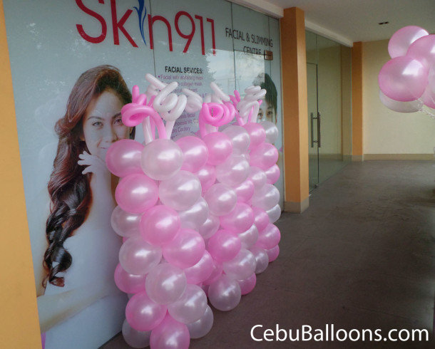 Pink & White-colored Balloon Pillars at Skin911