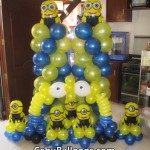 Columns with two-eyed Minions, Centerpieces with one-eyed Minions, & Cake Arch