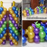 Tall Mardi Gras Balloon Pillars with Ground Balloons for Bridges Team Effort Internation 1st Anniversary